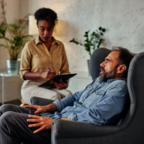 psychologist evaluating adult patient
