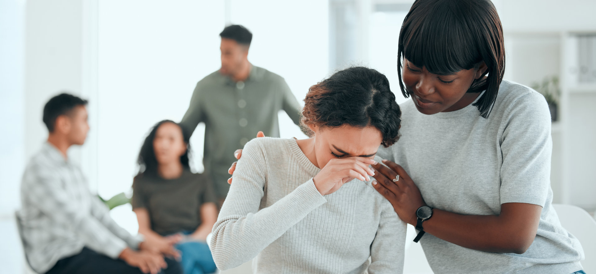 woman comforting colleague