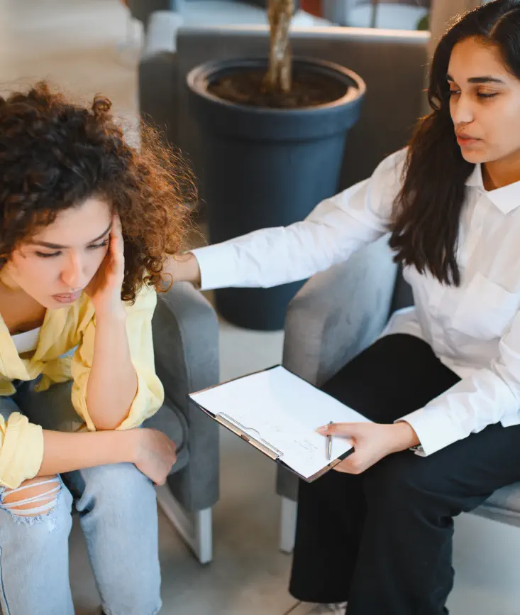 therapist comforting depressed patient