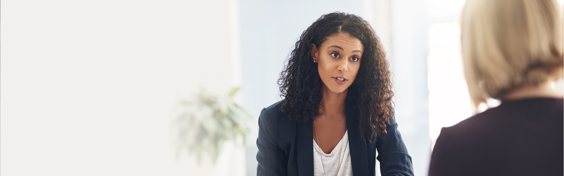 woman in suite talking to patient