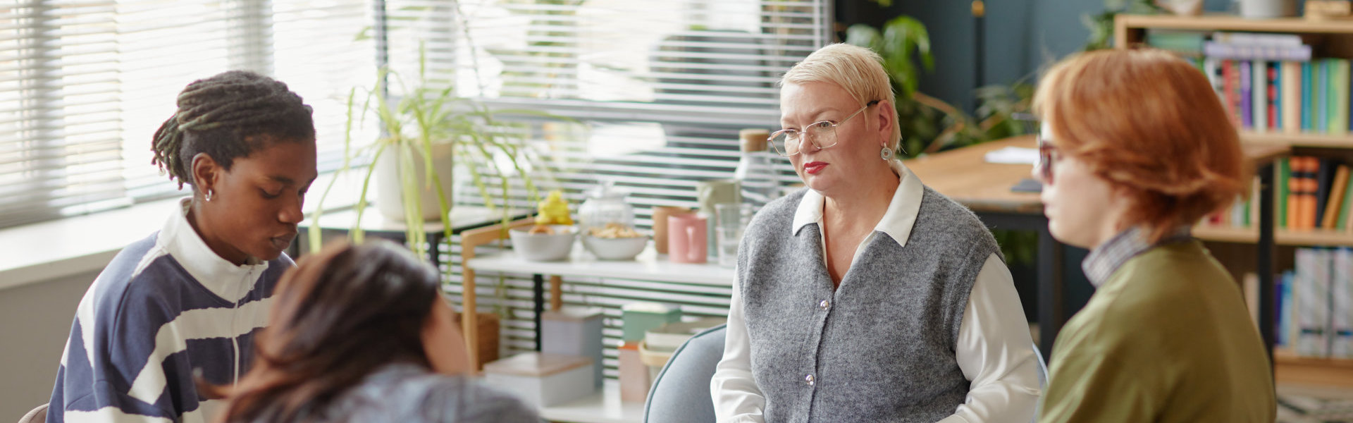 woman facilitating group therapy session