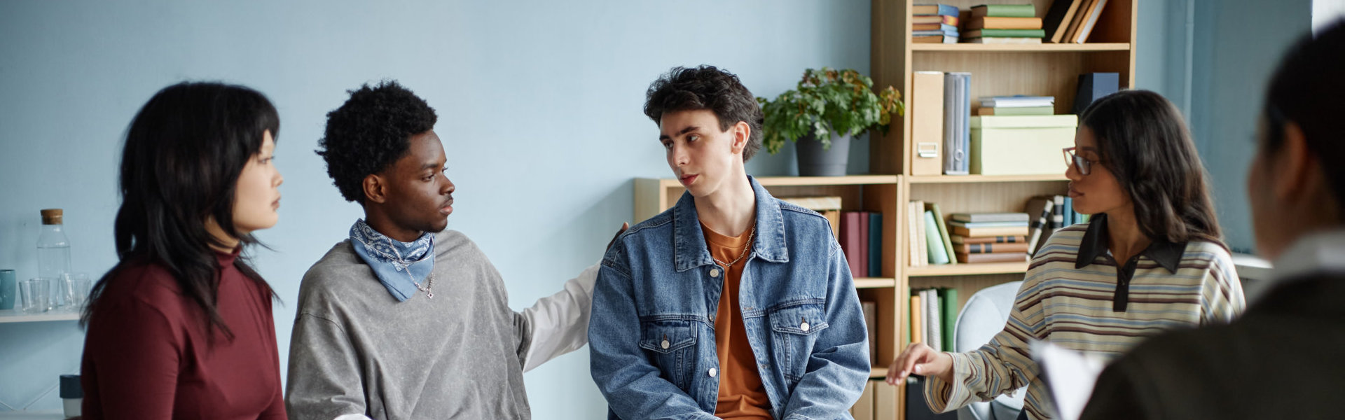 Group Therapy Session with Young Adults and Therapist